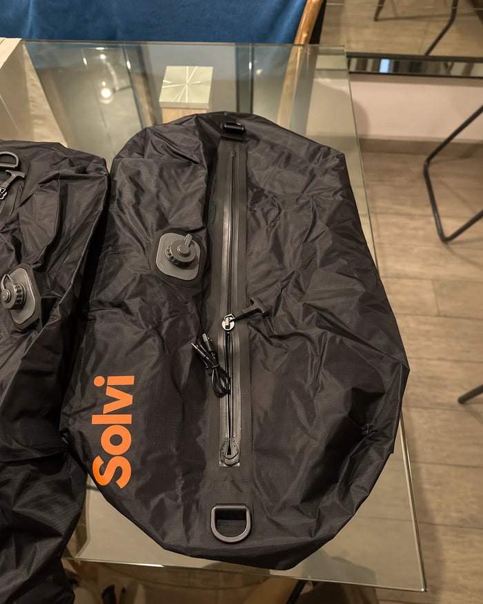 Two Solvi ClickVac compression bags with the built-in pump valve and USB-C cable
