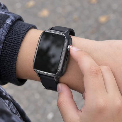 Solvi SE kids smartwatch in black on a child's wrist, outdoors